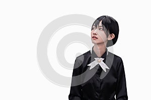 A girl dressed in black against a white background