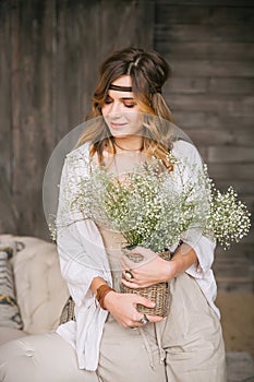 Girl dressed with large bouquets of white flowers