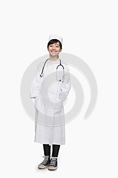 Girl dressed up as older doctor, studio shot