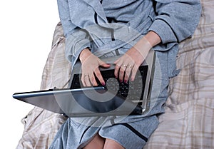 The girl in a dressing gown with the laptop