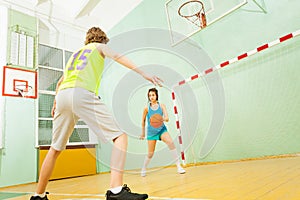 Girl dribbling the ball during basketball match