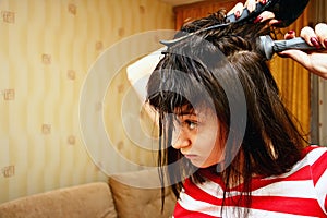 Girl dries hair