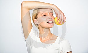Girl drink fresh juice whole lemon fruit. Healthy lifestyle and organic nutrition. Lemonade fills you with energy