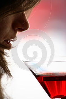 Girl drink a glass of alcoholic beverage
