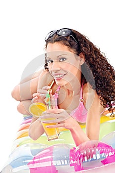 Girl drink juice on air mattress