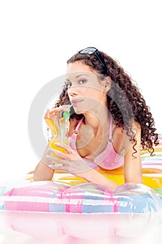 Girl drink juice on air mattress