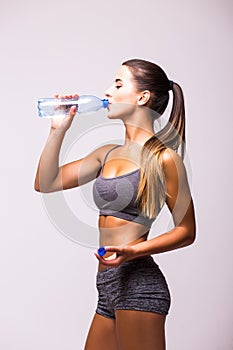 girl drink water after exercise