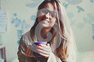 Girl drinking coffee in bed