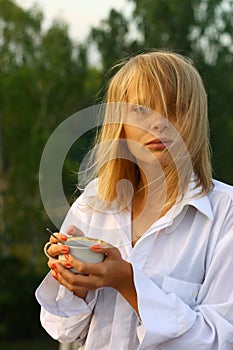 Girl drinking coffee in the morning