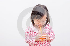 Girl drinking orange juice