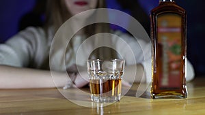 Girl drinking rum in a bar at a party