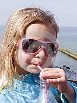 Girl drinking with a straw