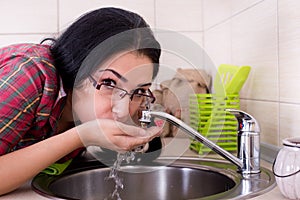 Girl drinking tap water