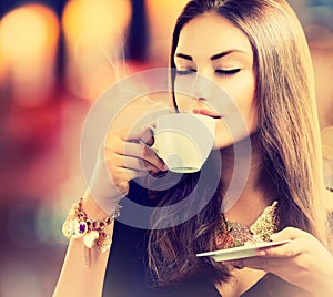 Girl Drinking Tea or Coffee