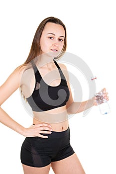 Girl drinking water from bottle after running sport gym