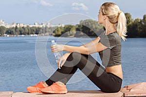 Girl drinking water on the breather photo