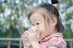 Girl drinking water from glass