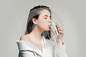 Girl drinking water glass. Beautiful young woman with clean fresh skin.