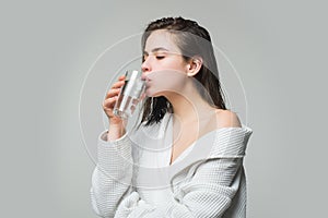 Girl drinking water glass. Beautiful young woman with clean fresh skin.