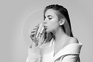 Girl drinking water glass. Beautiful young woman with clean fresh skin.