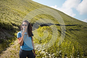 Girl drinking water from her hydration pack