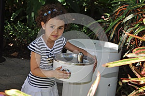 Girl drinking water photo