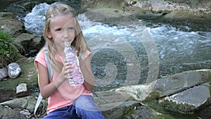 Girl Drinking Water by River, Child in Camping in Mountains, Kid Drink Fresh Spring Water, Outdoor In Nature, Children Healthcare