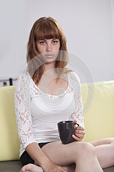 Girl drinking with straight look photo