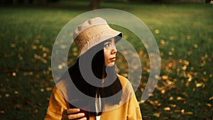 Girl drinks tea and looks away