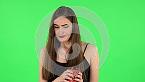 Girl drinks unpalatable coffee and is disgusted on green screen