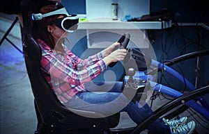 Girl driving a virtual machine with virtual reality glasses