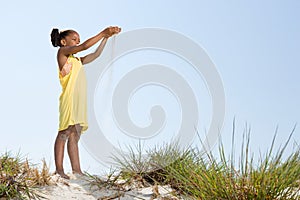 Girl dropping sand