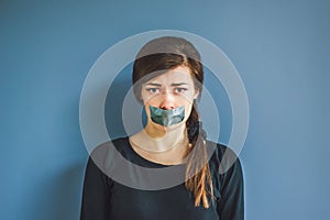 Girl with duct tape over her mouth