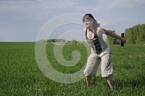 Girl with dumbbells squating outdoors