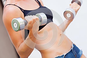 Girl with dumbell