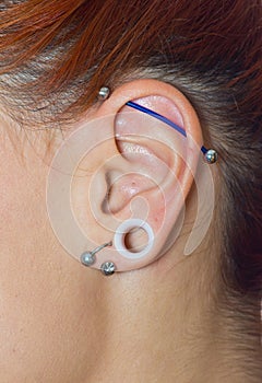 Girl ear with piercings