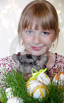 Girl with Easter decorations and chinchilla