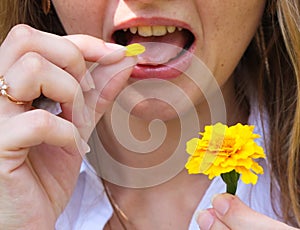 Girl eat flower petal