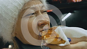 Girl eat pizza cheese four. Close up of young woman mouth greedily eating pizza and chewing in outdoor restaurant. Junk