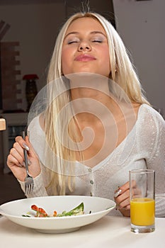 The girl eat tasty salad 2