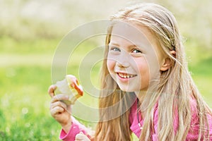 girl eating Apple. Child eating healthy fruit