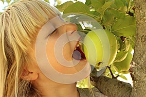 Girl Eating Apple in Tree