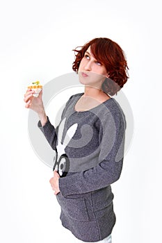 Girl eating cake and holding his stomach