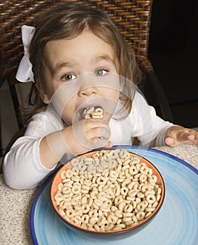 Girl eating cereal.