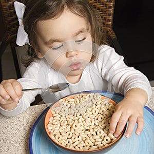 Girl eating cereal.