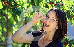 Girl eating cherry