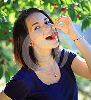 Girl eating cherry