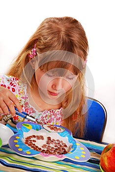 Girl eating chocolate cornflakes