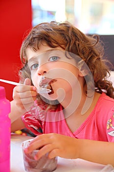 Girl eating chocolate ice cream dirty face