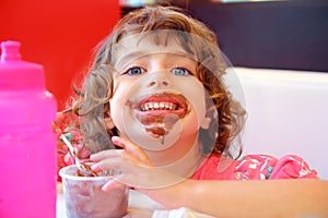 Girl eating chocolate ice cream dirty face